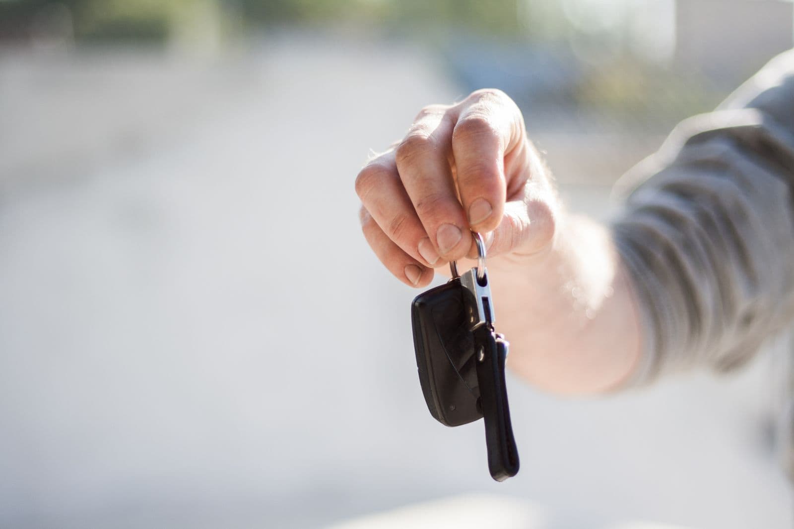 Handing over car keys after getting covered